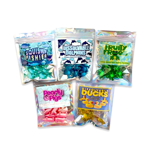 Five colorful packages of bath pearls, with various names and graphics on a white background. Bath Pearls, retro gifts,  scented oil, christmas, birthday, 90s gifts